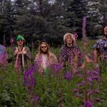 The Seward-based band Blackwater Railroad Company poses amongst fireweed. (photo courtesy Blackwater Railroad Company)