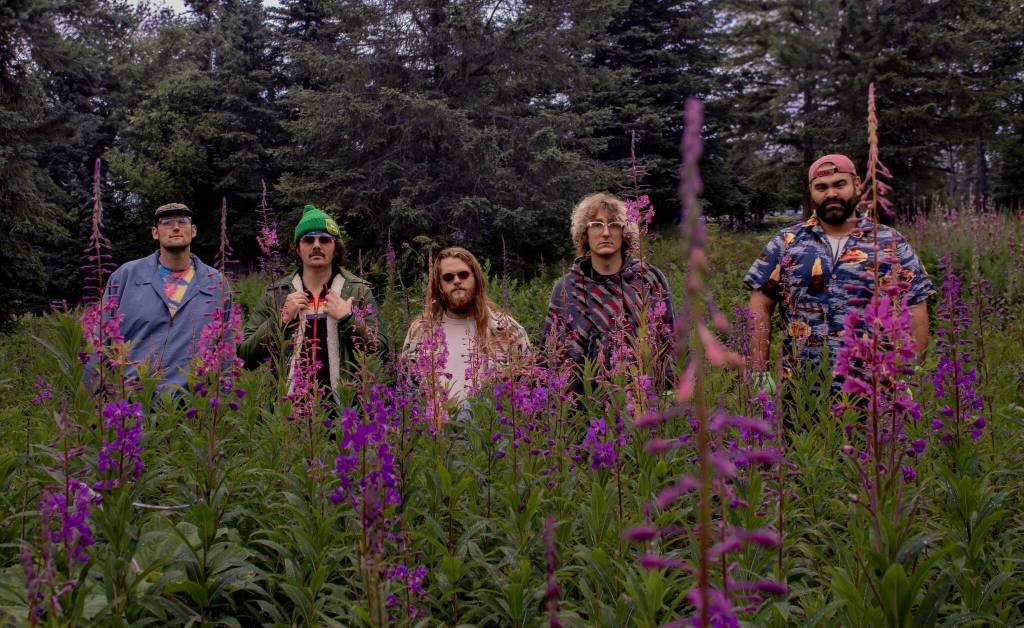 The Seward-based band Blackwater Railroad Company poses amongst fireweed. (photo courtesy Blackwater Railroad Company)