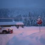 A truck with a snowplow drives along Douglas Highway on Dec. 31, 2025. (Mari Kanagy / Juneau Empire)