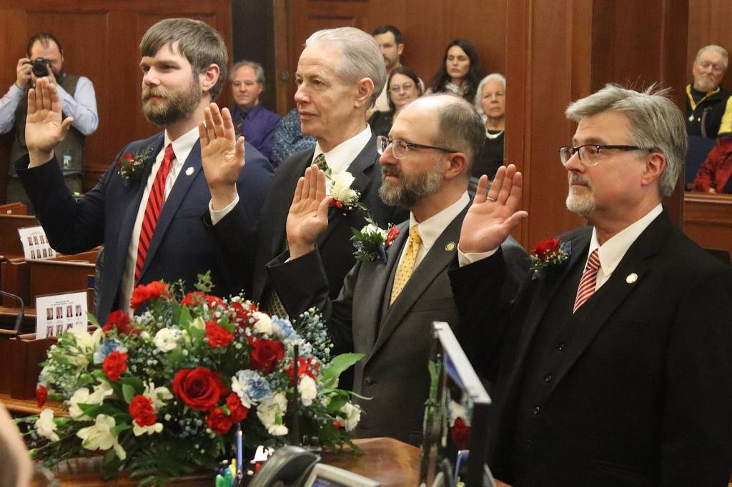 State Sens. Jesse Bjorkman (R-Nikiski), Matt Claman (D-Anchorage), Jesse Kiehl (D-Juneau) and Sen. James Kaufman (R-Anchorage) are sworn in by Lt. Gov. Nancy Dahlstrom during the opening day of the 34th Alaska State Legislature on Tuesday at the Alaska State Capitol. (Mark Sabbatini / Juneau Empire file photo)