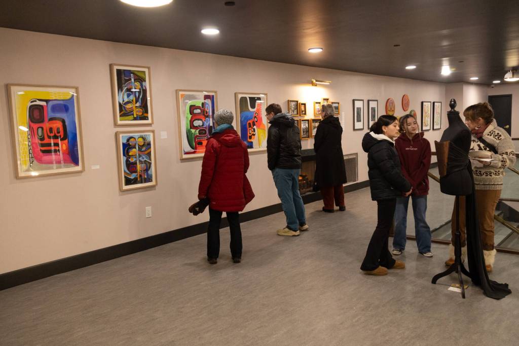 Dozens of people attended the opening of Gestures of Our Rebel Bodies, a group exhibition by seven Indigenous artists, at Aan Hít in downtown Juneau on Saturday, Jan. 24. (Chloe Anderson/Juneau Empire)