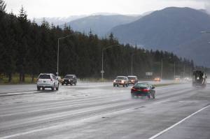 Cars pass down Egan Drive near the Fred Meyer intersection Thursday morning. (Clarise Larson / Juneau Empire file photo)