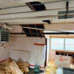 Photo courtesy of the Senate Finance Committee
Buckets catch water from a leaky roof in the attic of a Mt. Edgecumbe High School girls dormitory, seen by legislators on a legislators visit on Feb. 6, 2026.
