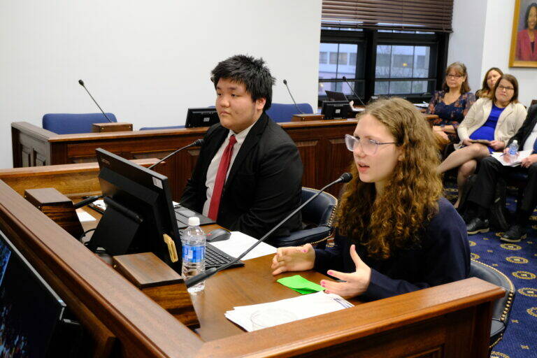 Mt. Edgecumbe sophomore Kadyn Cross (left) and junior Ilana Kalke (right) testify before legislators on Feb. 11, 2026. (Photo by Corinne Smith/Alaska Beacon)