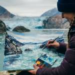 Photo courtesy of Paul Robbins. Claire Giordano paints a glacier using watercolors as the Tracy Arm Fords Terror Artist in Residency for 2024.