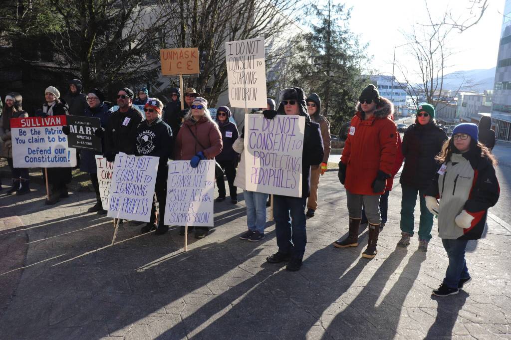 Protesters gather outside before Sullivan arrives at the capitol.
