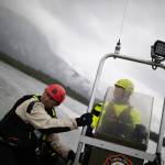 Captain Jayme Johns and Captain Anne Wilcock doing water rescue training on the fire department jet boat. (Photo courtesy of Jesse Inman)