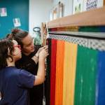 Lily Hope and her daughter Ella Hope creating the pride robe.