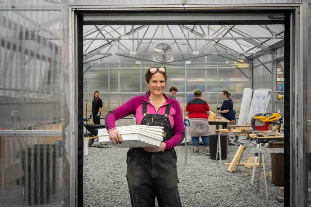 Pacific High School Garden Coordinator Andrea Fraga standing in front of Pacific High School Greenhouse (Photo by Ryan Morse)