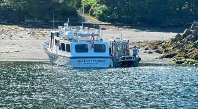 The motor vessel Eagle One Express (left) is beached alongside a good Samaritan vessel at Annette Island, Alaska, July 16, 2026. Four good Samaritan vessel crews responded to an Urgent Marine Information Broadcast to assist in the transportation of 36 passengers to Ketchikan. (U.S. Coast Guard courtesy photo)
