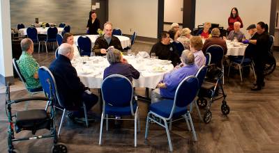 Family members join residents at Riverview Senior Living for dinner at the assisted living complex. (Mark Sabbatini / Juneau Empire file photo)