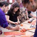 Regional healing catalyst Hanaackm Ggoadm Tsoal (left) processes salmon during the 2025 camp. Remember our connections to each other, know that we need each other, and remember our shared histories. Healing isnt an individual project, its collective, she says. (Ḵaa Yahaayí Shkalneegi Muriel Reid photo)
