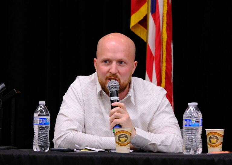 Democrat Jonathan Kreiss-Tomkins, a candidate for governor, speaks at a debate on education on July 30, 2026. (Photo by Corinne Smith/Alaska Beacon)